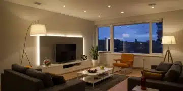 Modern living room with diverse, stylish lighting for ambiance and function.