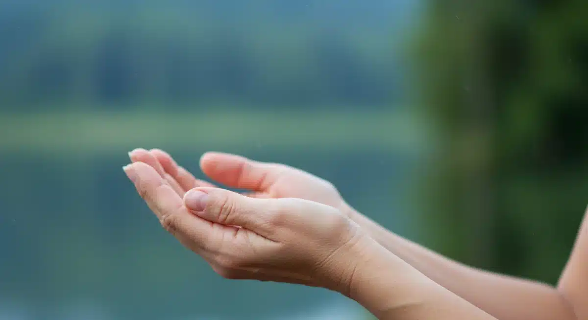Hands cupped in focused breathing exercise for mindfulness