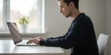 Increase Your Focus: Strategies for Eliminating Distractions Person focused on laptop at minimalist desk