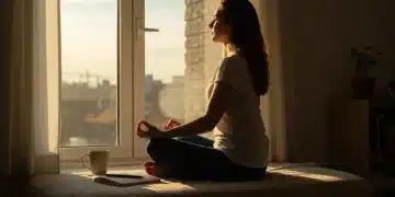Person meditating to optimize morning routine for productivity